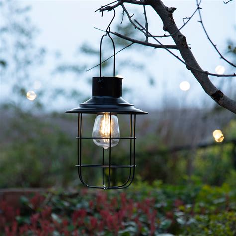 Beautifully hand-painted multi-colored glass forms the balloon and a string of flickering solar powered LED lights give the effect of flames shooting up form the burner engine. . Lowes outdoor lanterns